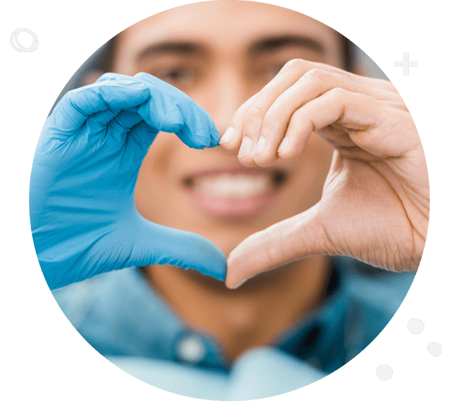 Dental patient making heart symbol with hands